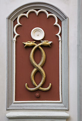 Image showing Wall decoration of two tangled snakes