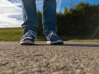 Image showing man feet on cobbled road