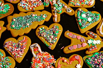 Image showing Homemade christmas cookies on a dark table