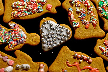 Image showing Homemade christmas cookies on a dark table