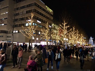 Image showing People are walking through the city and the Christmas market