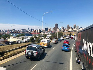 Image showing Johannesburg Central Business District buildings and roads as seen from out of a driving car.