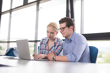 Image showing Two Business People Working With laptop in office