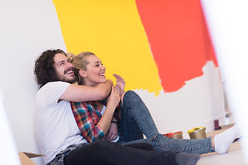 Image showing Happy young couple relaxing after painting