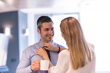 Image showing A young couple is preparing for a job and using a laptop