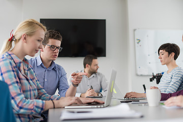 Image showing Two Business People Working With laptop in office