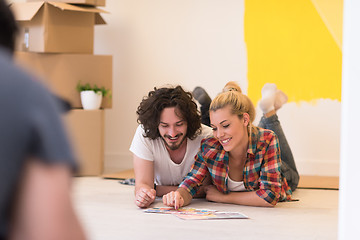 Image showing Happy young couple relaxing after painting