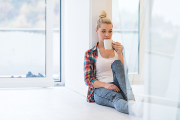 Image showing Portrait of a beautiful girl on the floor