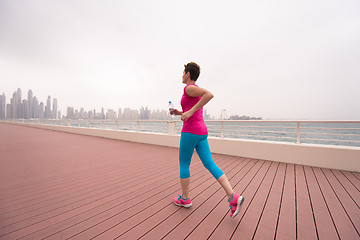 Image showing woman running on the promenade