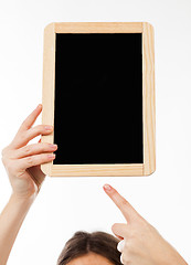 Image showing woman\'s hands holding a blackboard publicity