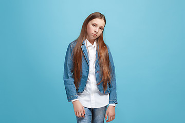 Image showing Young serious thoughtful teen girl. Doubt concept.