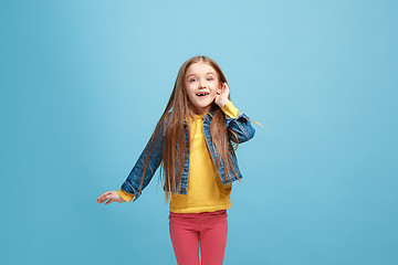 Image showing The happy teel girl standing and listening