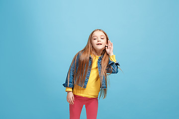 Image showing The happy teel girl standing and listening