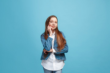 Image showing Young serious thoughtful teen girl. Doubt concept.