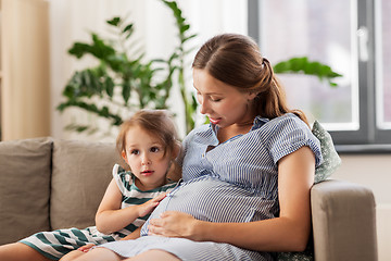 Image showing pregnant mother and daughter at home