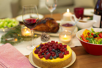 Image showing cake and other food on christmas table at home