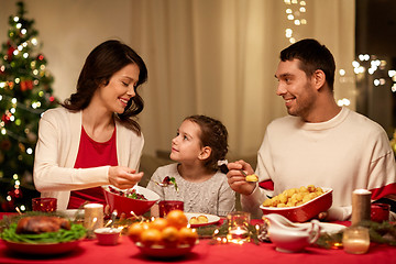 Image showing happy family having christmas dinner at home