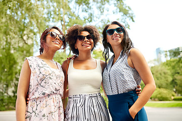 Image showing happy young women in sunglasses at summer park