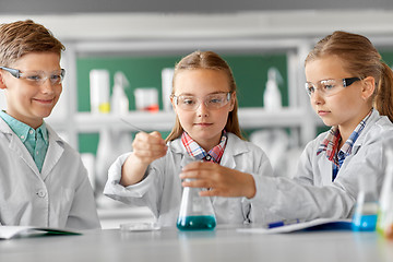 Image showing kids with test tube studying chemistry at school