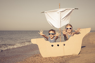 Image showing Happy children playing on the beach at the day time.