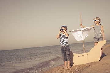 Image showing Happy children playing on the beach at the day time.