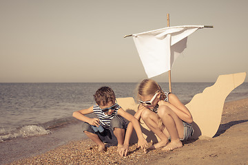 Image showing Happy children playing on the beach at the day time.