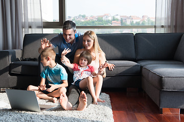 Image showing Family Playing Together with laptop computer