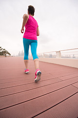 Image showing woman running on the promenade