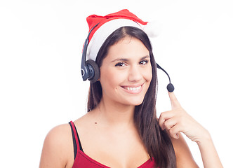 Image showing Christmas headset woman from telemarketing call center wearing red santa hat talking smiling isolated on white background.