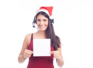 Image showing Christmas phone operator woman showing blank signboard