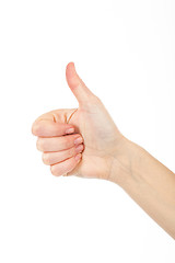 Image showing Woman giving thumb-up for showing success. Woman\'s right hand is nice idea.