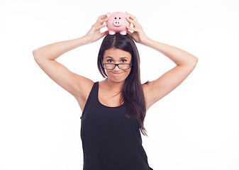 Image showing Young woman hold a piggy bank