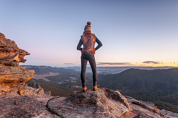 Image showing Bushwalker on summit of mountain with valley views