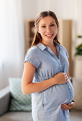 Image showing happy pregnant woman with belly at home