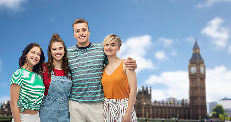 Image showing happy friends over houses of parliament in london