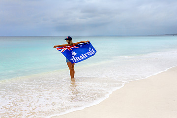 Image showing Woman on beach holding Australian Flag, travel, tourism, Australia Day