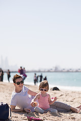 Image showing Mom and daughter on the beach