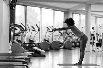 Image showing african american woman exercise yoga in gym