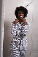 Image showing beautiful black woman wearing  bathrobe