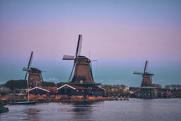 Image showing Windmills at Zaanse Schans in Holland in twilight after sunset.