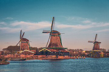 Image showing Windmills at Zaanse Schans in Holland in twilight after sunset.