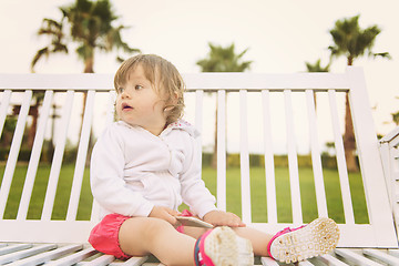 Image showing little girl playing with mobile phone