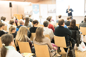 Image showing Business speaker giving a talk at business conference event.