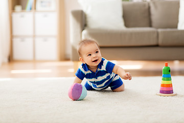 Image showing sweet little asian baby boy with toys at home