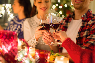 Image showing close up of friends with wine celebrate christmas