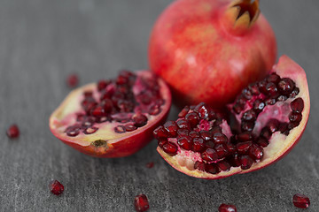 Image showing close up of pomegranate on stone table