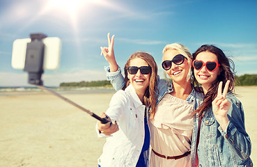 Image showing group of smiling women taking selfie on beach