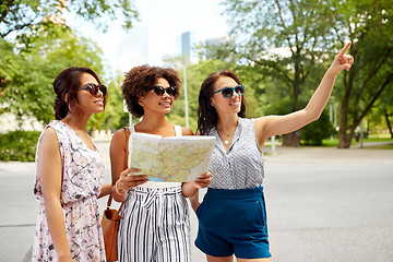 Image showing happy women with map on street in summer city