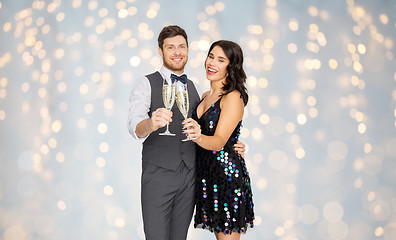 Image showing happy couple with champagne glasses at party