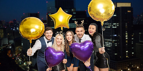 Image showing friends at christmas party over night city